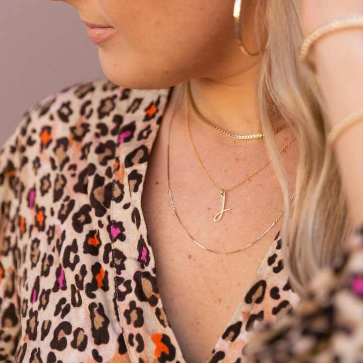  @theoceanminded wearing Nella Initial Pendant